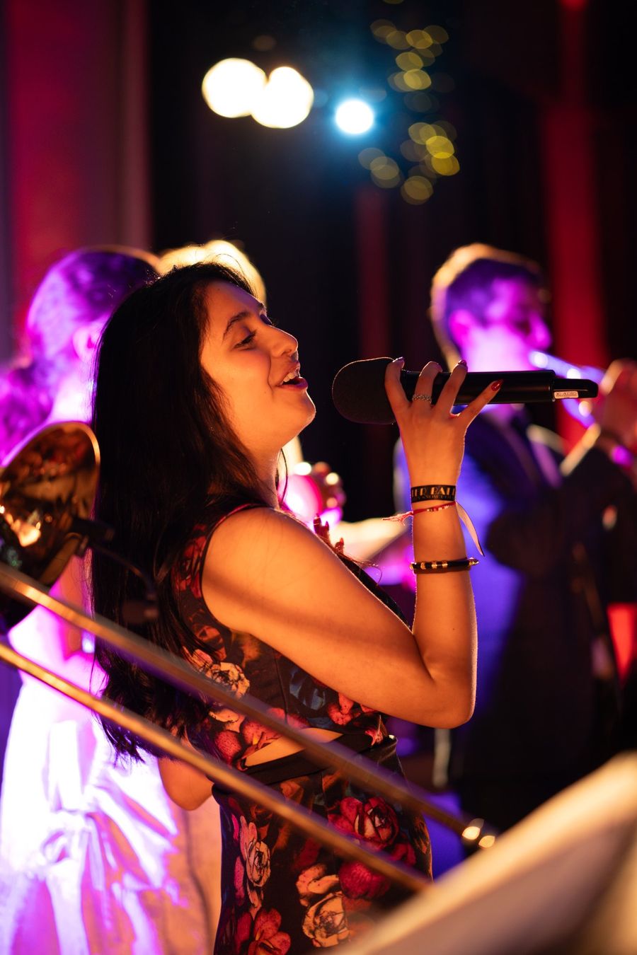Singer performing under stage lighting