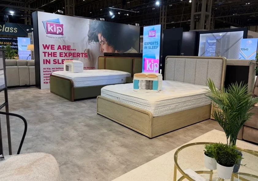 Kip sleep section with branded signage and bed displays