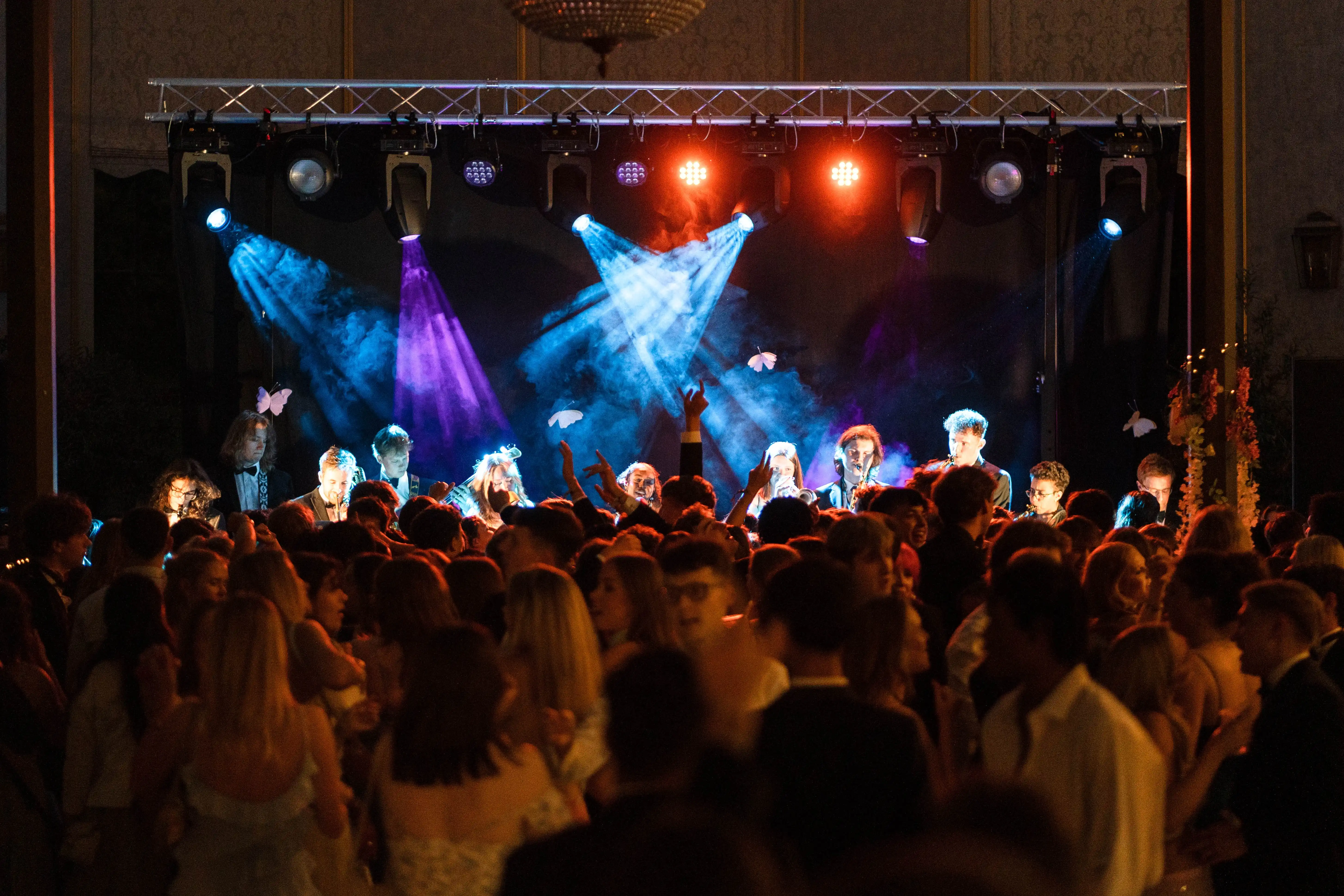 Live band performing on stage with themed lighting