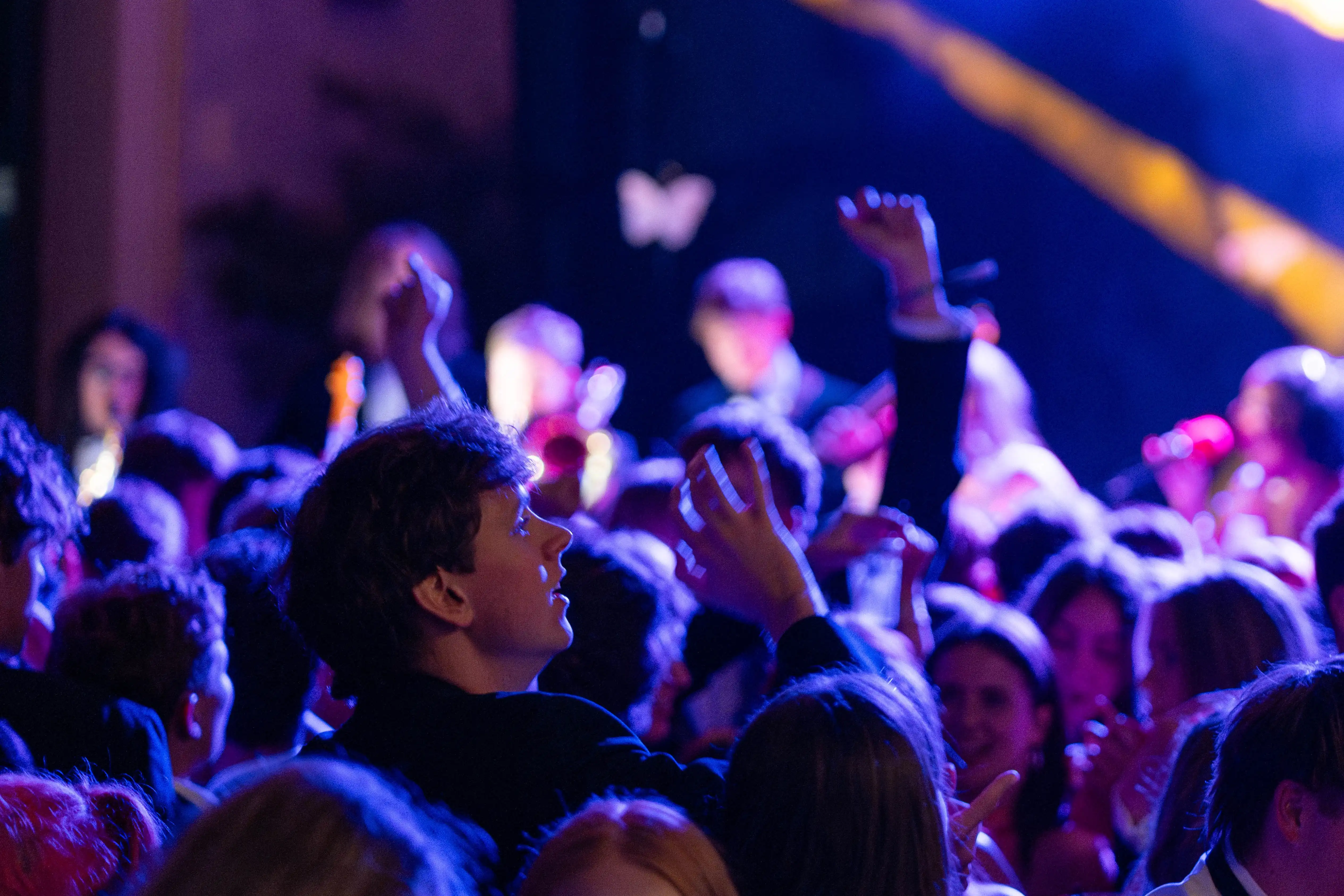 Guests dancing under lighting during the ball series
